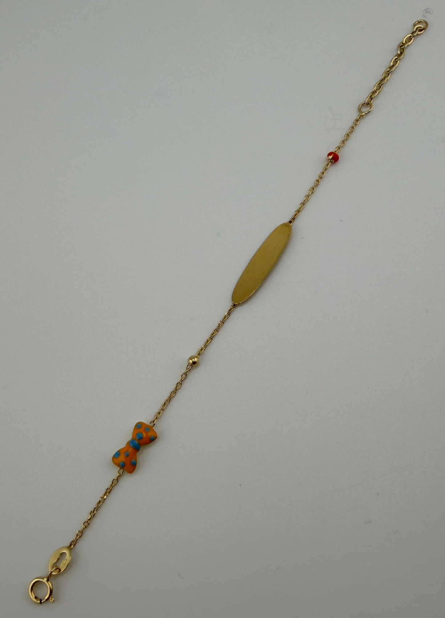 Bracelet Petit Nœud à pois pour bébé en or 18 carats